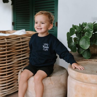 Kid wearing Dale Raine’s Cool Kids Club Crew Neck - comfortable embroidered clothing, locally handmade in Cape Town for everyday style.